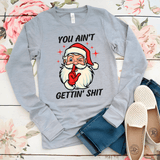 Gray long-sleeve shirt with Santa Claus graphic and text on a floral background