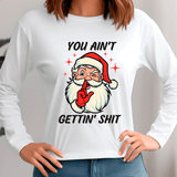 White sweatshirt with a graphic of Santa Claus and text, worn by a person.