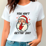 White t-shirt with a graphic of Santa Claus and text on a plain background