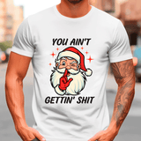White t-shirt with a graphic of Santa Claus and text, worn by a person.