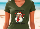 Green t-shirt with a graphic of Santa Claus and text on a beach background