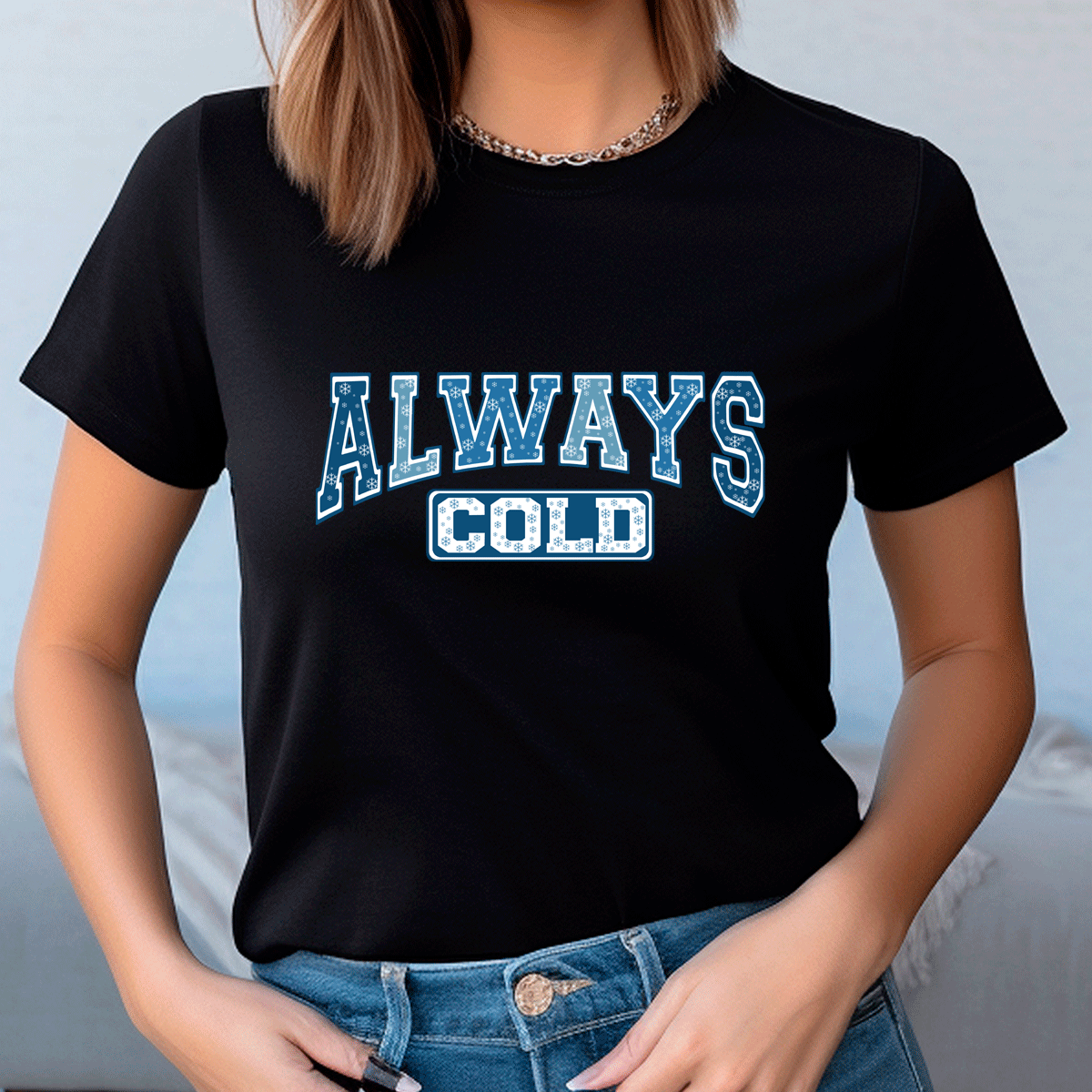 Person wearing a black t-shirt with 'ALWAYS COLD' text in blue and white.