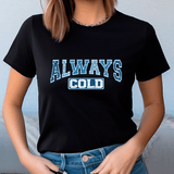 Person wearing a black t-shirt with 'ALWAYS COLD' text in blue and white.