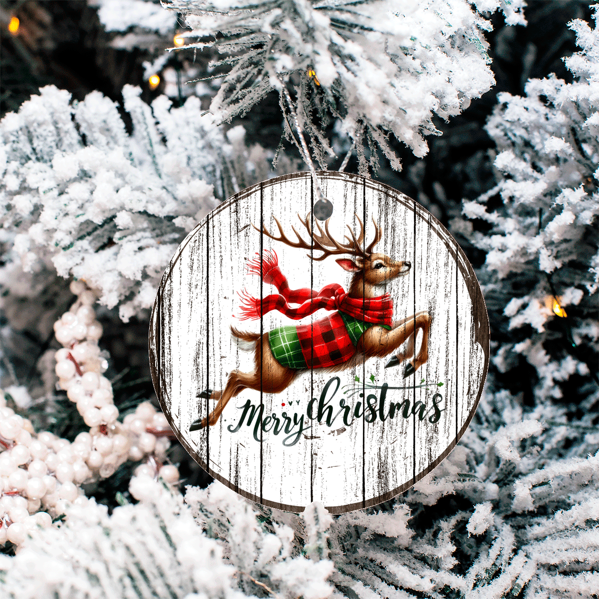 Decorative Christmas ornament with a reindeer wearing a scarf and 'Merry Christmas' text, hanging on a tree.