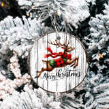 Decorative Christmas ornament with a reindeer wearing a scarf and 'Merry Christmas' text, hanging on a tree.