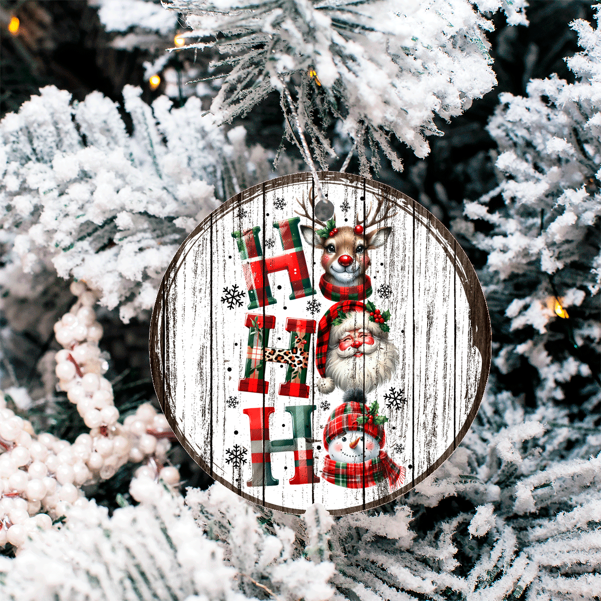 Decorative Christmas ornament with reindeer, snowman, and stockings on a wooden background, hanging on a tree.