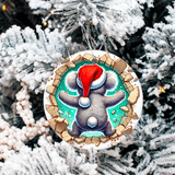 Decorative Christmas ornament with a cartoon character wearing a Santa hat on a snowy tree background