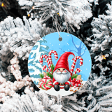 Decorative Christmas ornament with a gnome and candy canes on a snowy background, hanging from a tree.