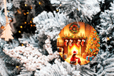 Decorative Christmas scene with a cozy fireplace inset surrounded by a snowy tree.
