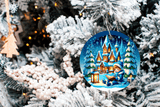 Decorative Christmas ornament with a winter scene on a tree