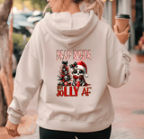 Person wearing a hoodie with Christmas-themed design and text.
