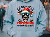 Light blue hoodie with a reindeer graphic and text in an urban setting