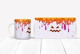 Halloween-themed mug and box with colorful design on a white background