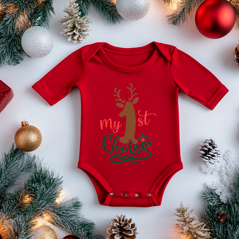 Red baby onesie with 'My First Christmas' text surrounded by holiday decorations on a white background