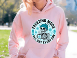 Person wearing a pink hoodie with a 'Freezing Mode' graphic design.