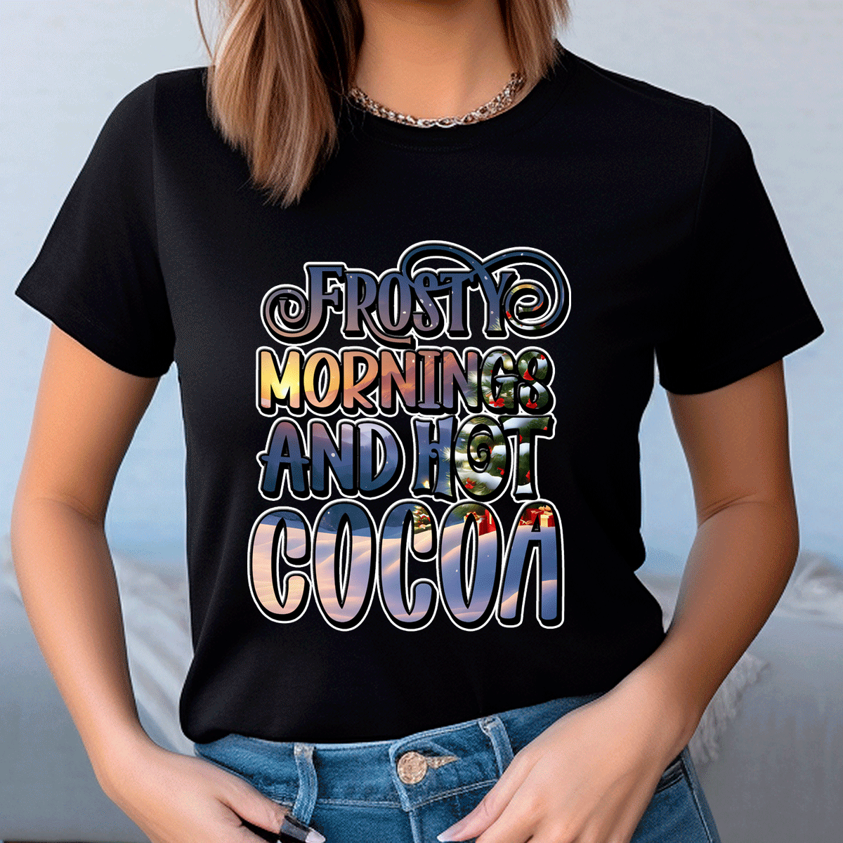 Person wearing a black t-shirt with 'Frosty mornings and hot cocoa' text design.