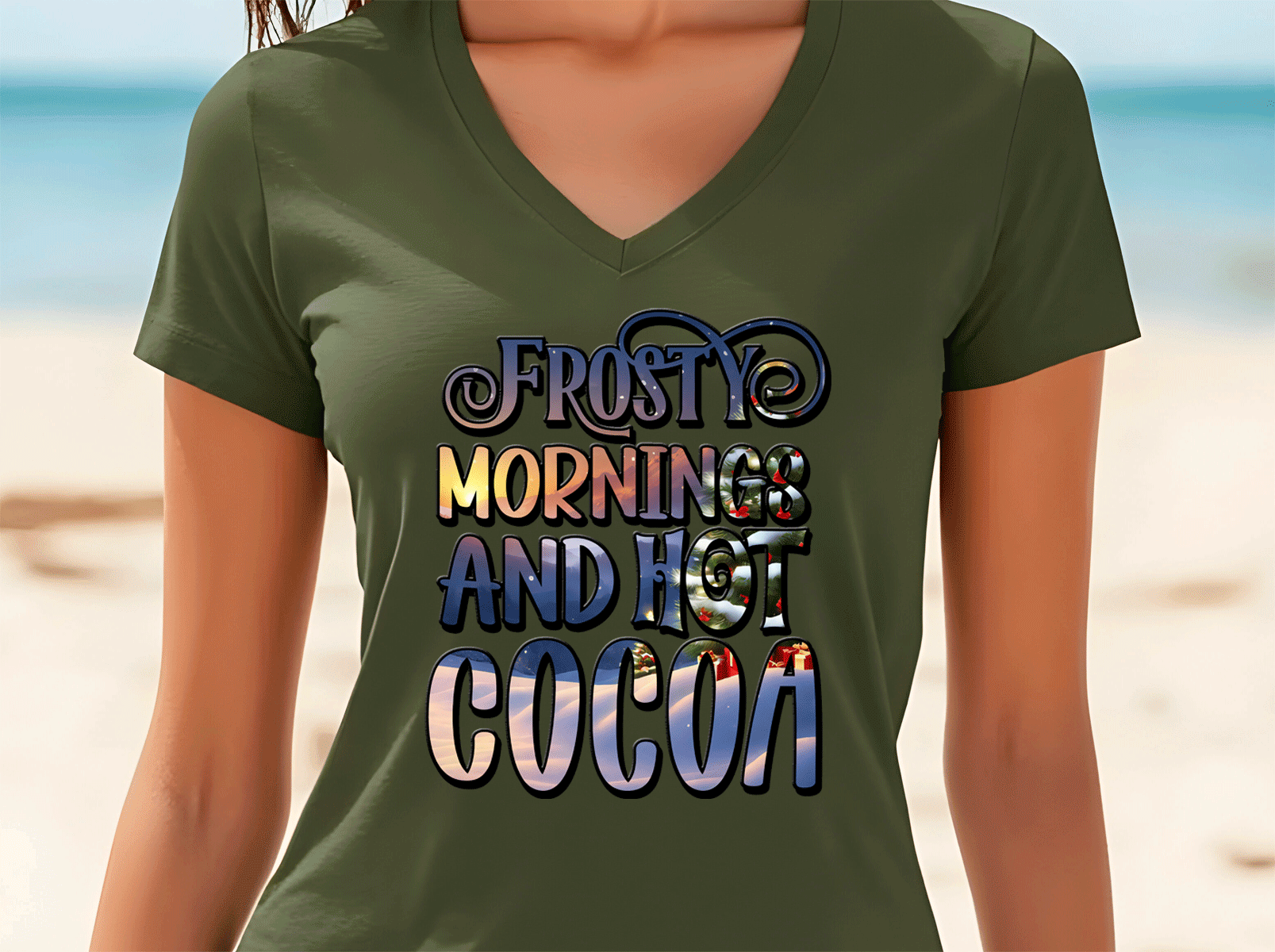 Person wearing a green t-shirt with 'Frosty mornings and hot cocoa' text on a beach background