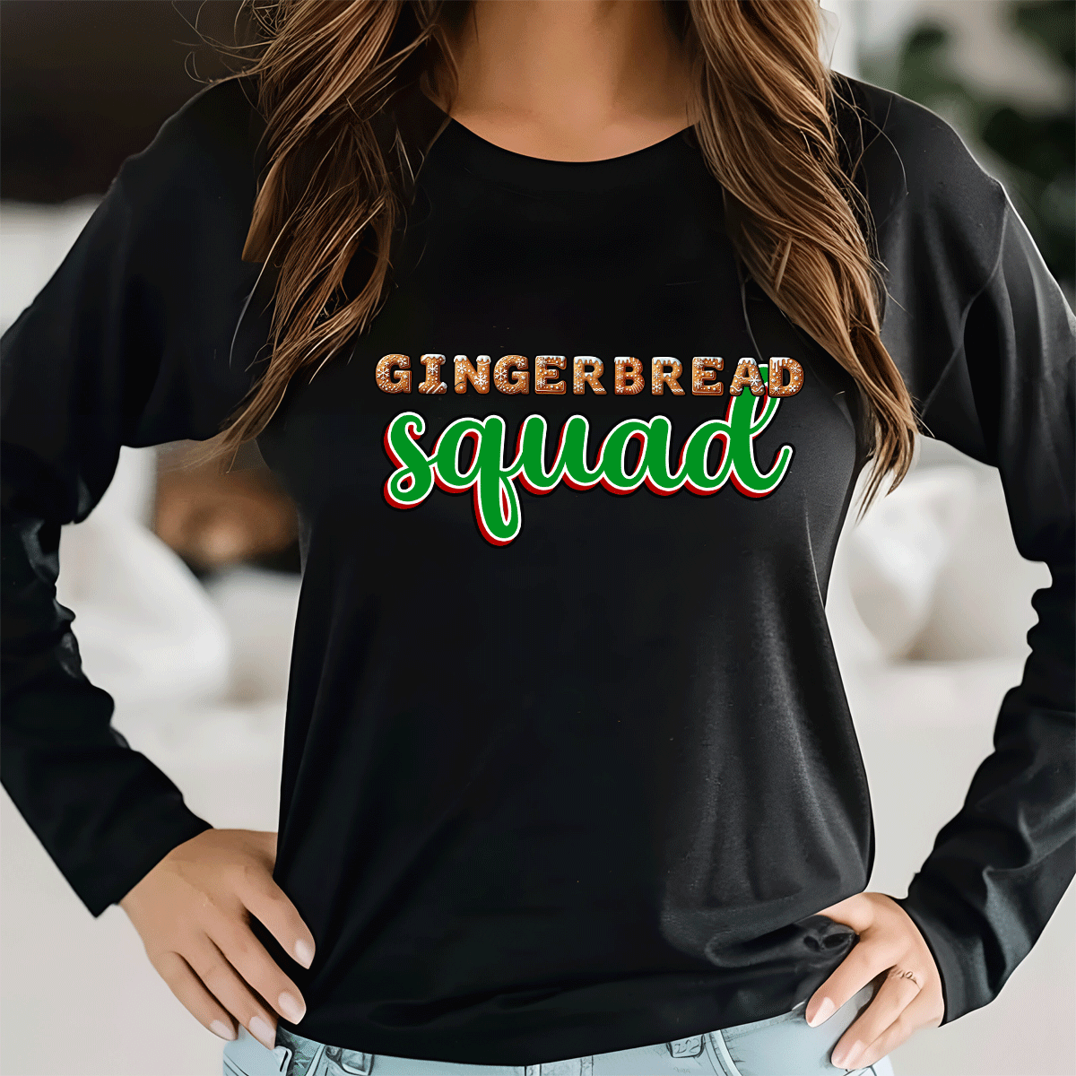 Black long-sleeve shirt with 'GINGERBREAD SQUAD' text worn by a person indoors.