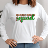 White long-sleeve shirt with 'Gingerbread Squad' text worn by a person.
