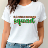 White t-shirt with 'GINGERBREAD SQUAD' text worn by a person