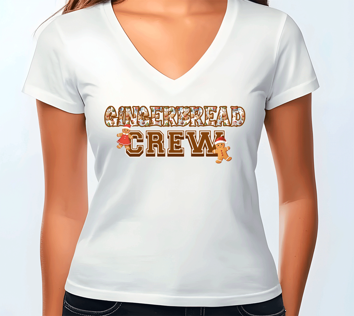 White t-shirt with 'Gingerbread Crew' text and gingerbread man graphics on a plain background