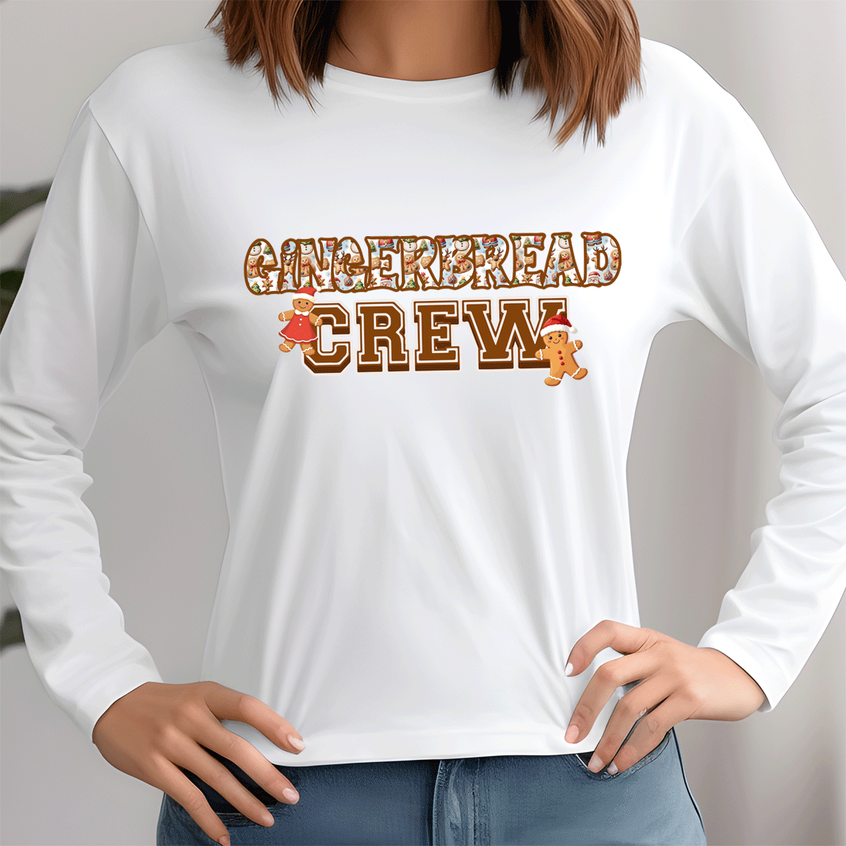 White long-sleeve shirt with 'Gingerbread Crew' text and graphics on a plain background