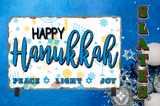 Decorative sign with 'Happy Hanukkah' text on a blue background