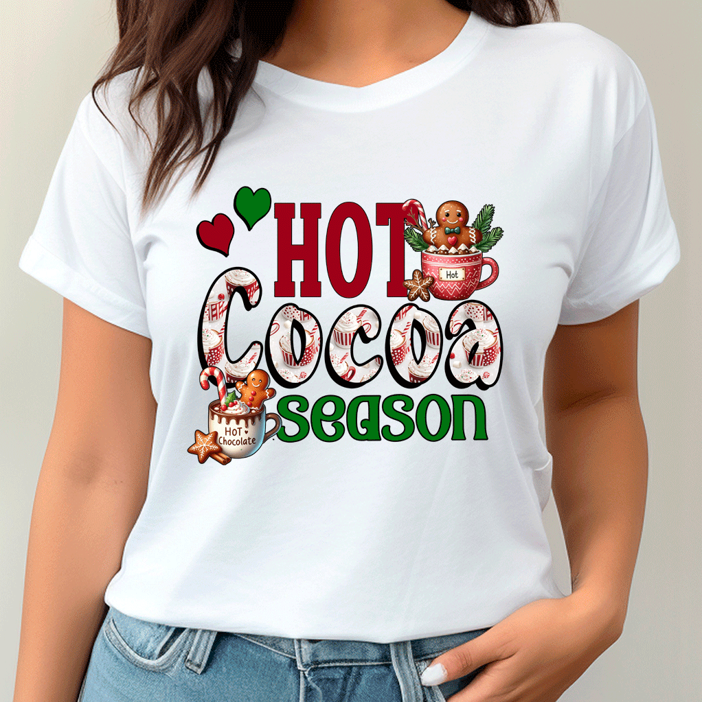 White t-shirt with 'Hot Cocoa Season' graphic design worn by a person.