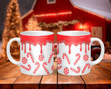 Two Christmas-themed mugs with candy cane and number 20 designs on a wooden surface.