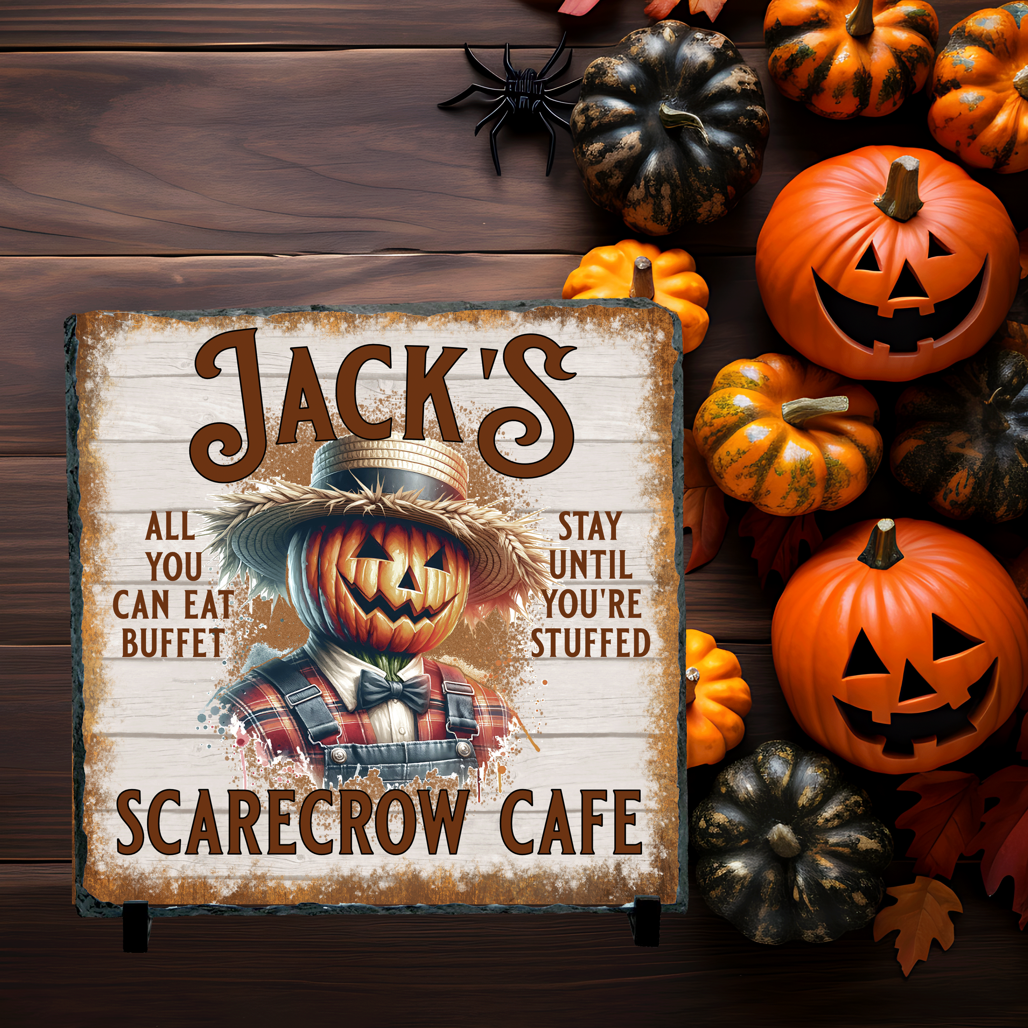 Halloween-themed sign with pumpkins and a scarecrow on a slate background