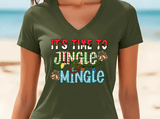 Person wearing a green t-shirt with 'It's time to jingle and mingle' text on a beach background
