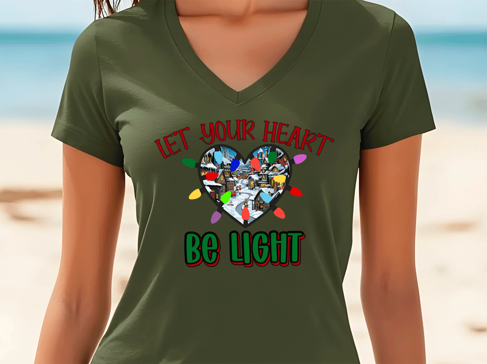 Person wearing a green t-shirt with a heart design and text on a beach background