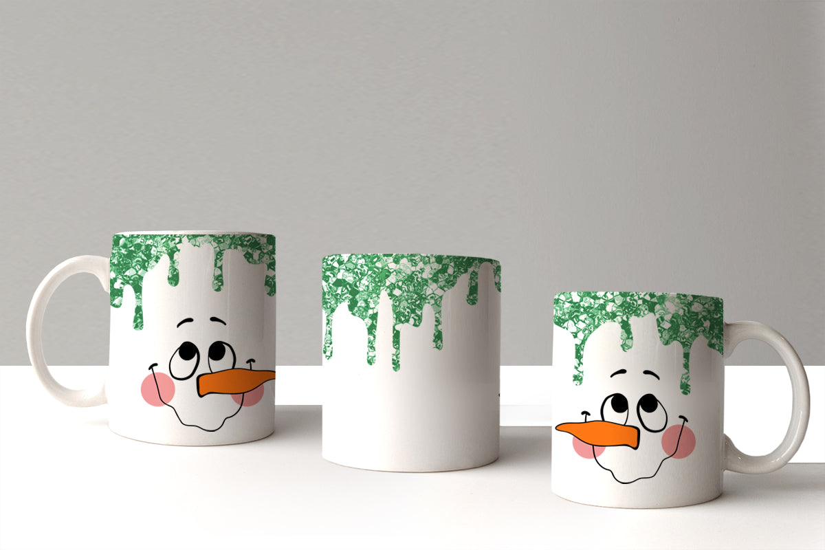 Three mugs with snowman faces and green drips on a white background