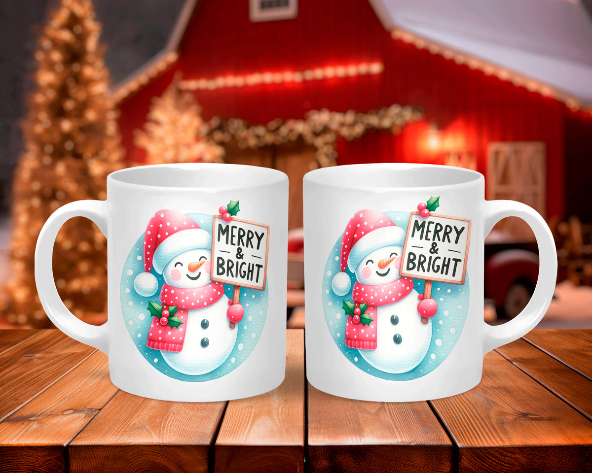 Two Christmas-themed mugs with a snowman design and 'Merry & Bright' text on a wooden table.