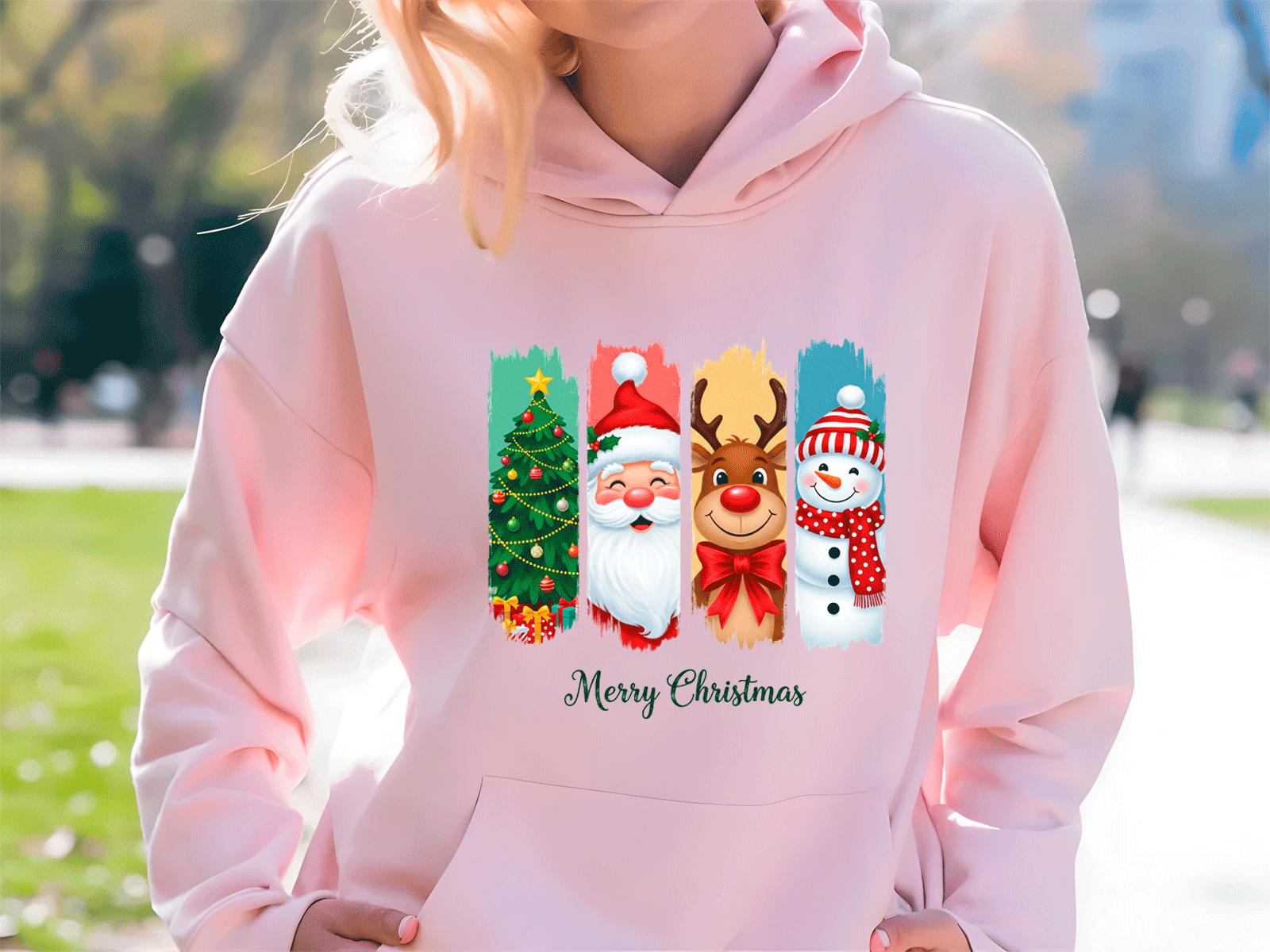 Person wearing a pink hoodie with Christmas-themed designs and 'Merry Christmas' text.