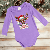 Purple baby onesie with a Christmas reindeer design on a wooden surface with holiday decorations.