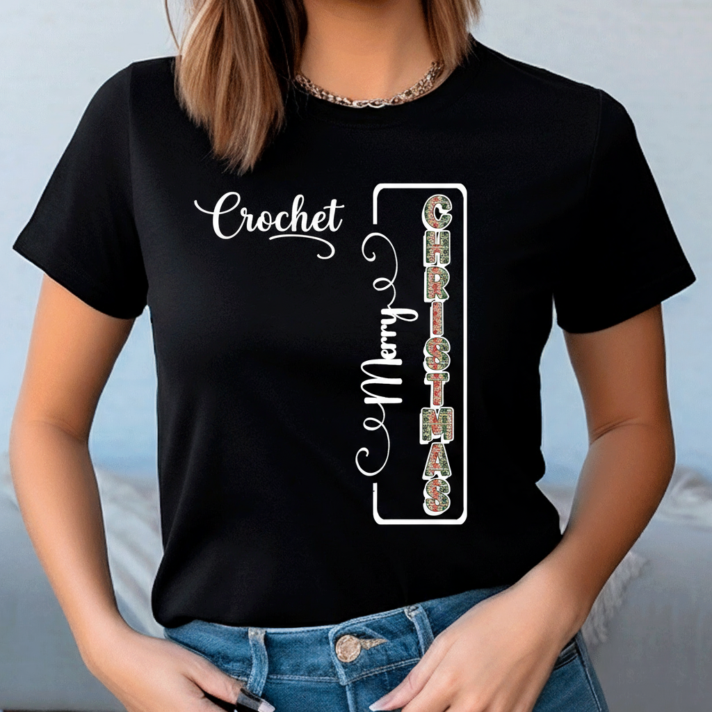 Person wearing a black t-shirt with decorative text design on a plain background