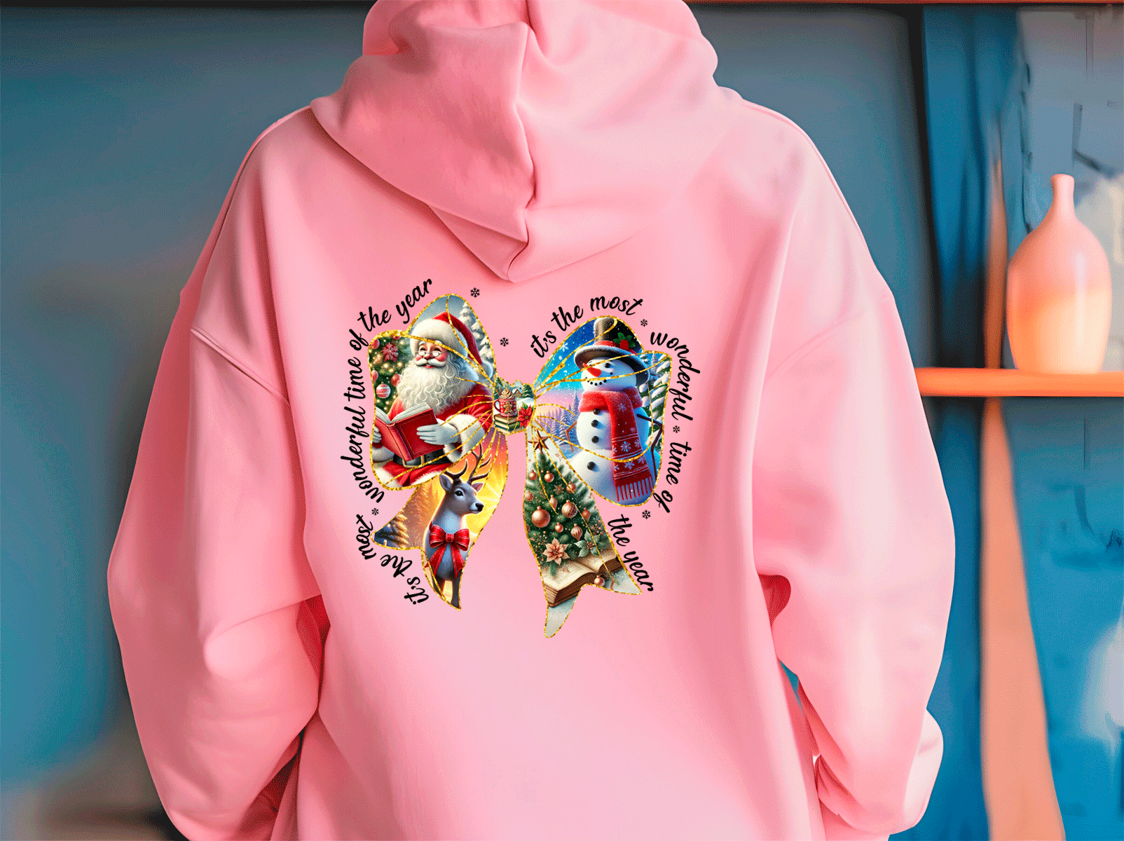 Pink hoodie with Christmas-themed design featuring Santa Claus, reindeer, and snowman on a blue background.