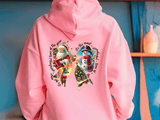 Pink hoodie with Christmas-themed design featuring Santa Claus, reindeer, and snowman on a blue background.