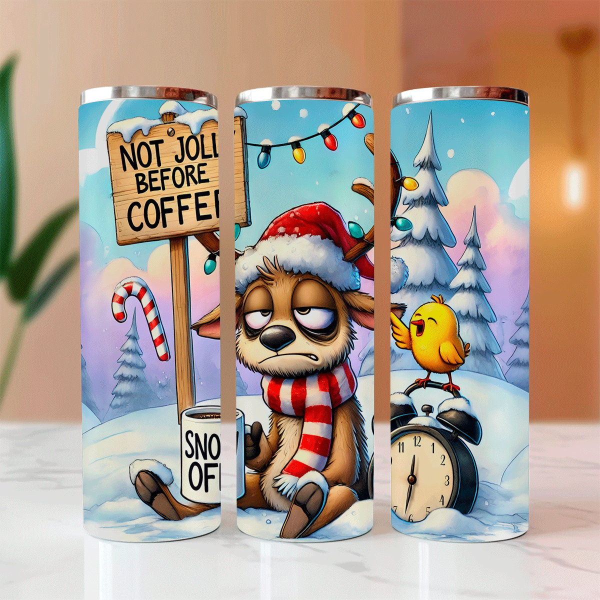 Three Christmas-themed tumblers with cartoon characters and festive designs.