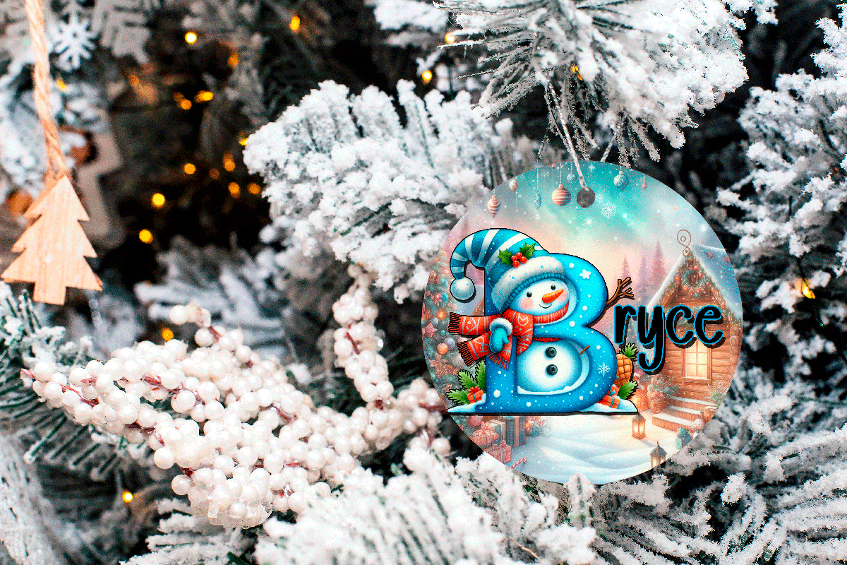 Decorative ornament with a snowman design and the name 'Bryce' on a Christmas tree.