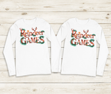 Two white long-sleeve shirts with 'Reindeer Games' text on a wooden surface
