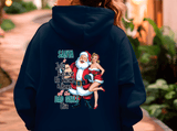 Navy blue hoodie with a graphic design of Santa Claus and a woman, text on the back, person wearing it outdoors.