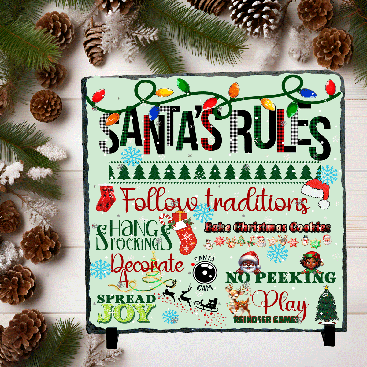 Christmas-themed sign with 'Santa's Rules' on a decorative background with pine cones and greenery.