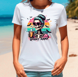Person wearing a white t-shirt with a colorful graphic design on a beach.