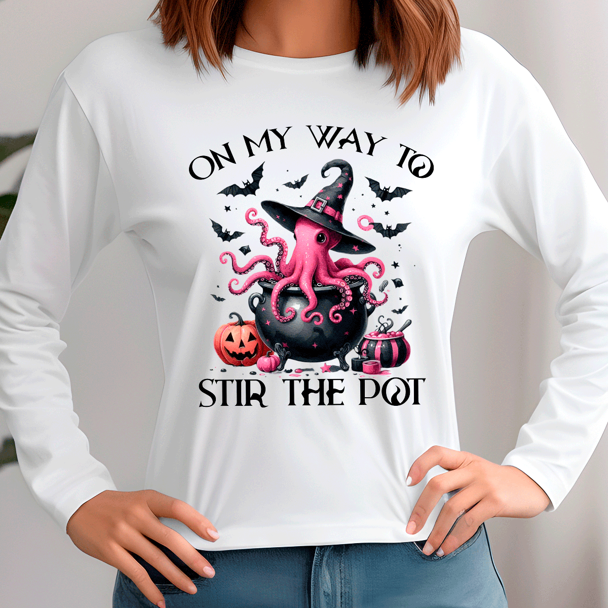 White sweatshirt with Halloween-themed design featuring an octopus, cauldron, and text.
