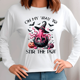 White sweatshirt with Halloween-themed design featuring an octopus, cauldron, and text.