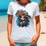 Person wearing a white t-shirt with a colorful skull and floral design on a beach.