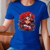 Person wearing a blue t-shirt with a colorful graphic design of a woman with flowers and skulls.