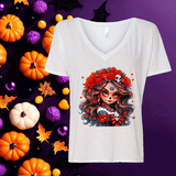 White V-neck t-shirt with a colorful graphic design on a purple background with Halloween-themed decorations.